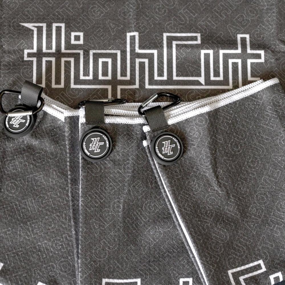 Detail photo of the High Cut Tour Golf Towel showing the magnet, hook and design