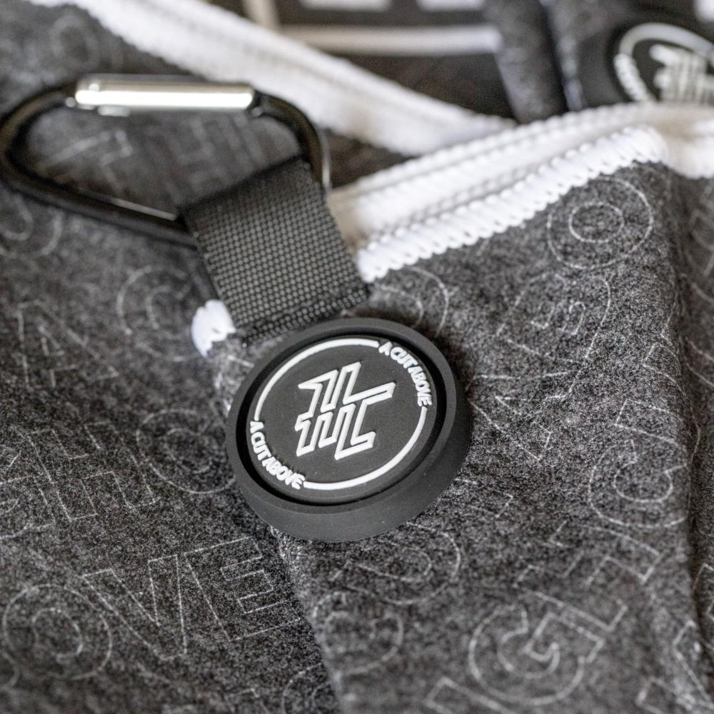 Detail photo of the High Cut Tour Golf Towel showing the magnet, hook and design