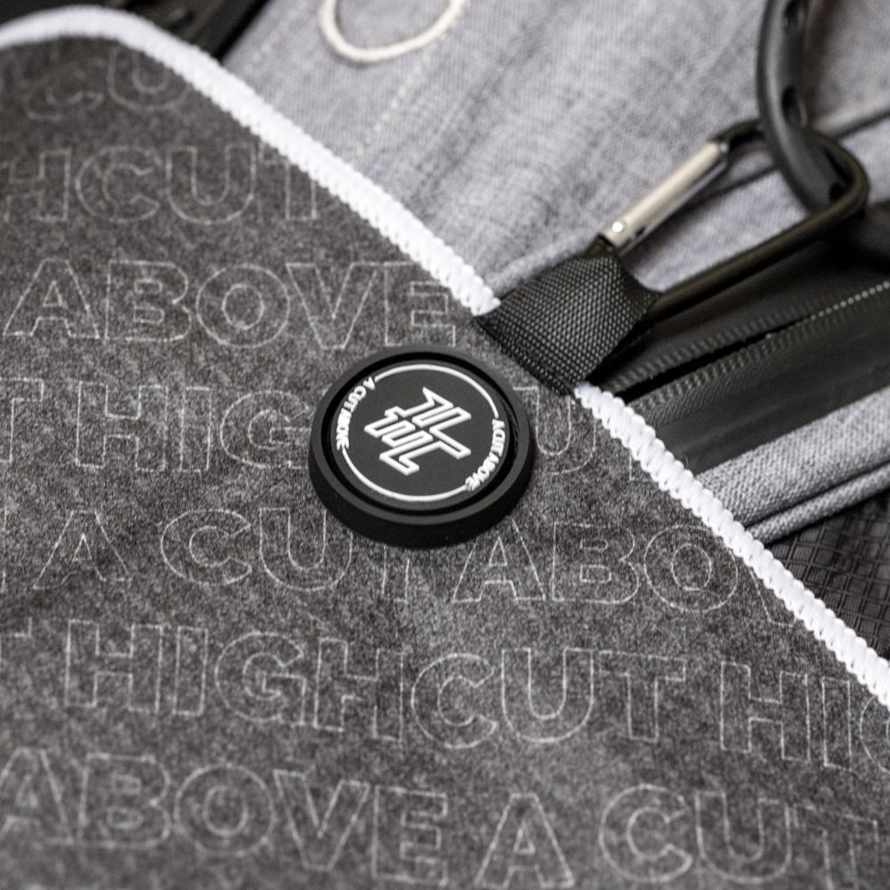 Detail photo of the High Cut Tour Golf Towel showing the magnet, hook and design