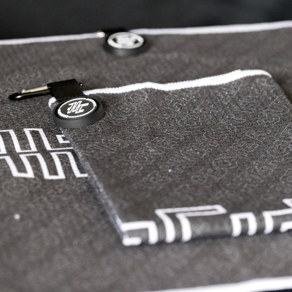 Detail photo of the High Cut Tour Golf Towel showing the magnet, hook and design