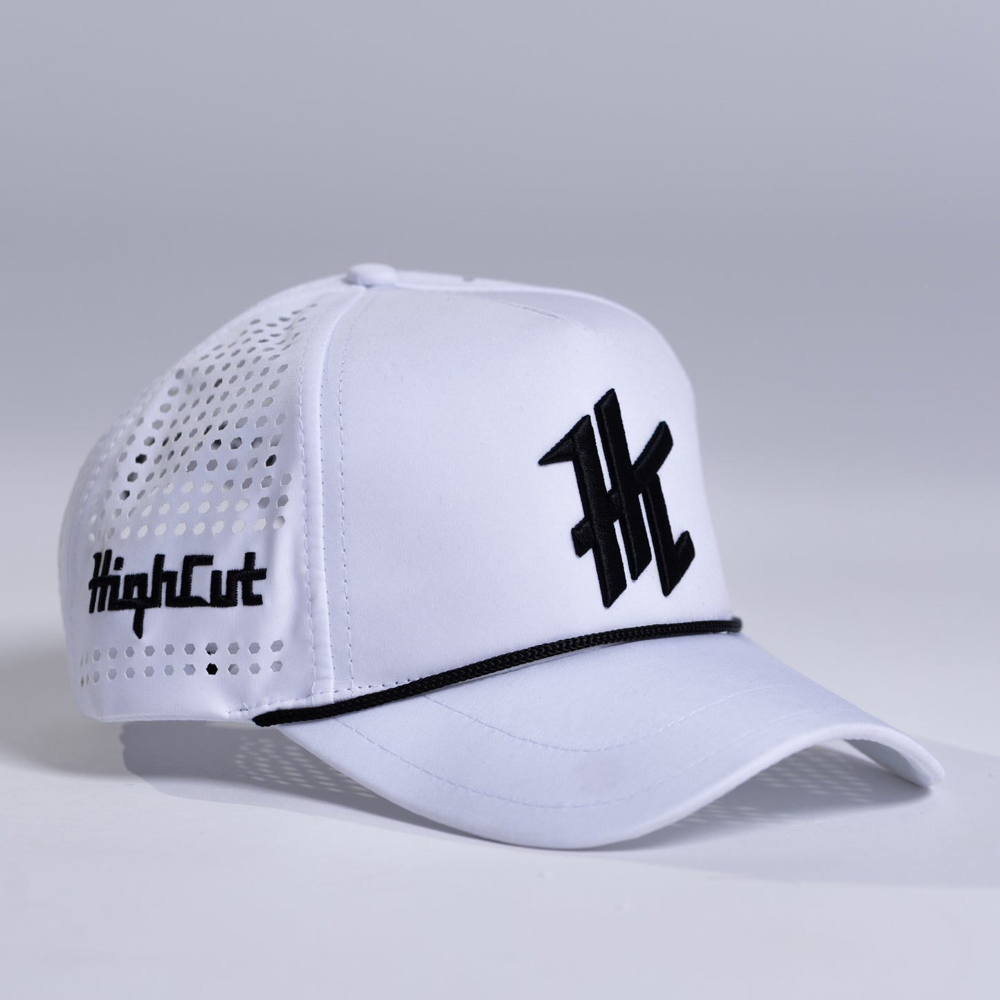 White Cap with a Black HC Logo by HighCut Golf New Zealand.