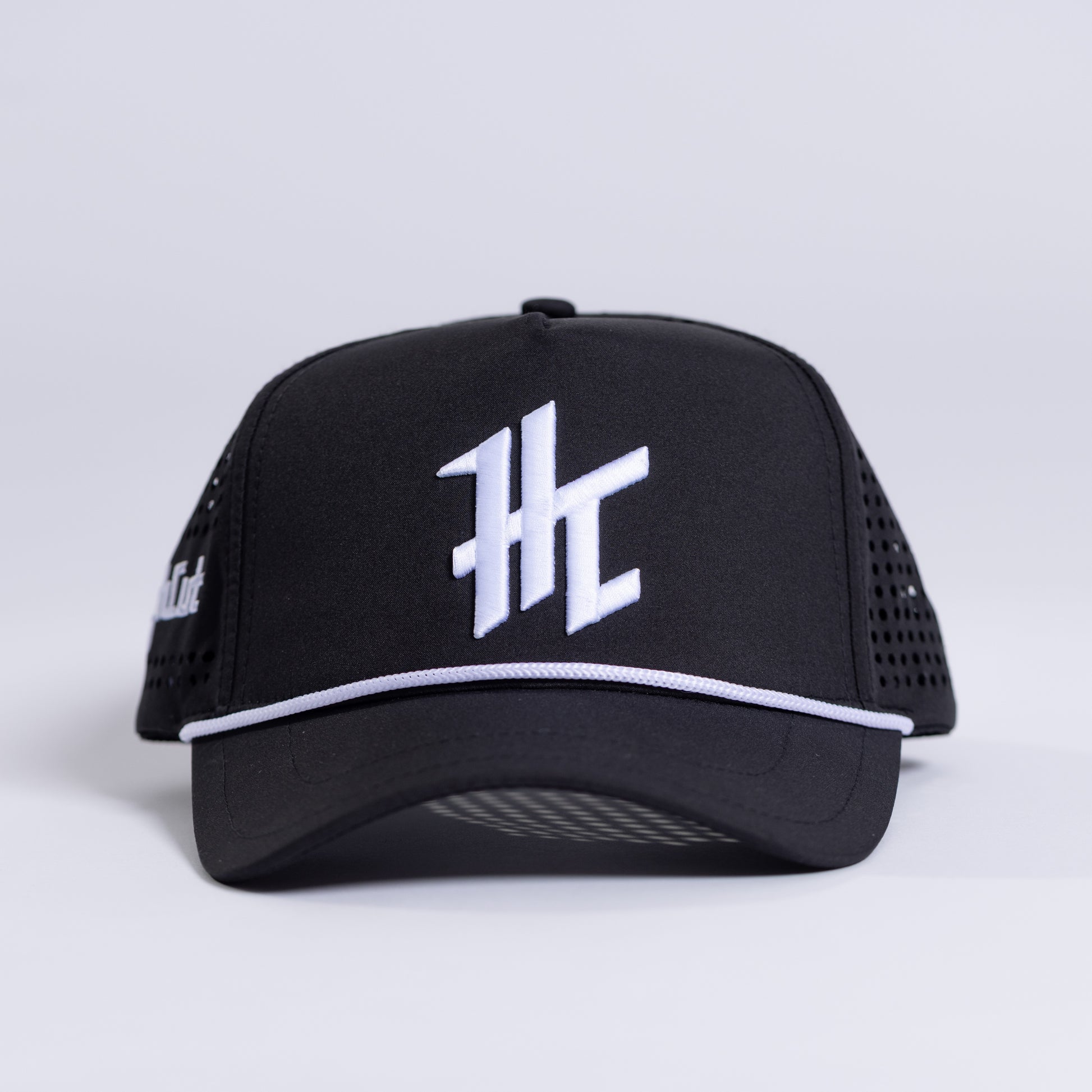 Black Cap with a White HC Logo by HighCut Golf New Zealand.
